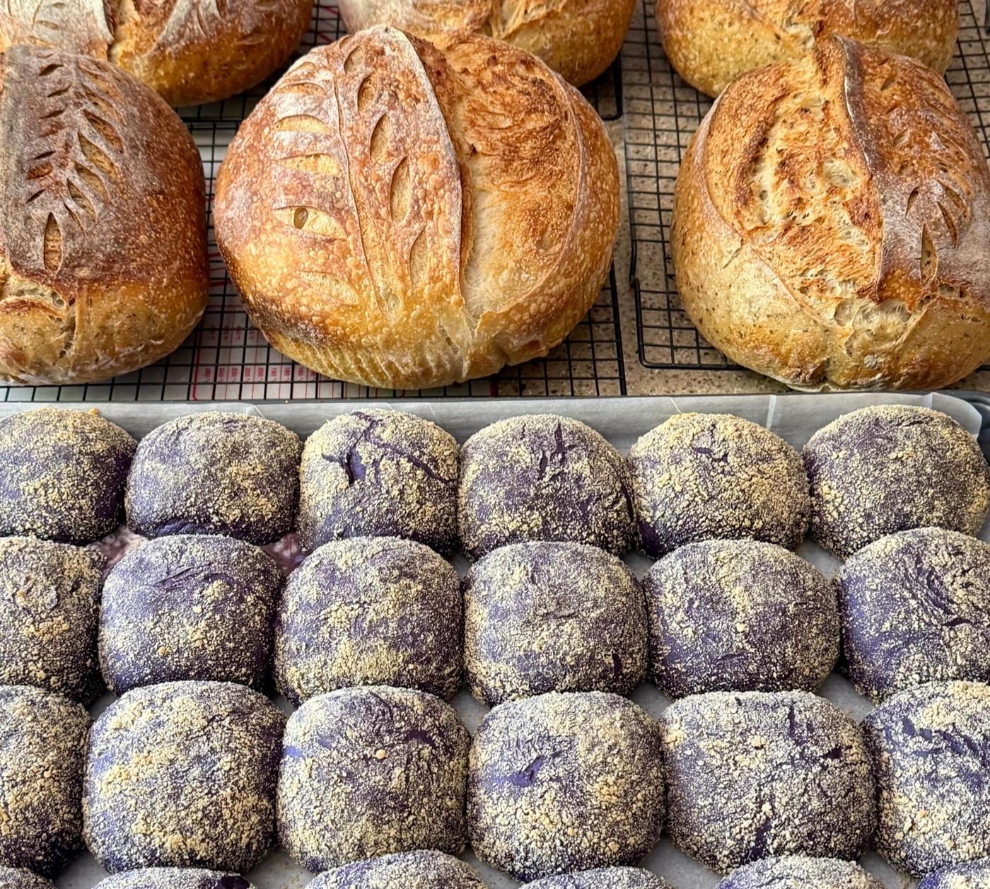 Fresh sourdough loaves and ube pandesal from April's Rising Kitchen